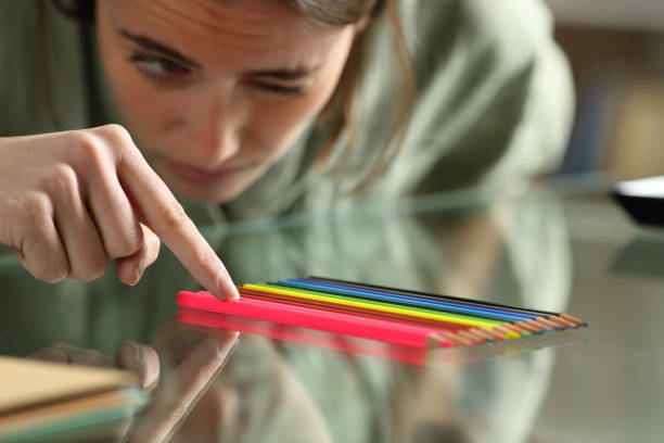 Girl lining pencils up to perfection