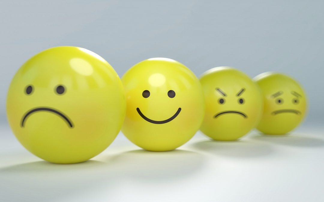 Smileys indicating sadness, happiness, anger and fear (left to right)